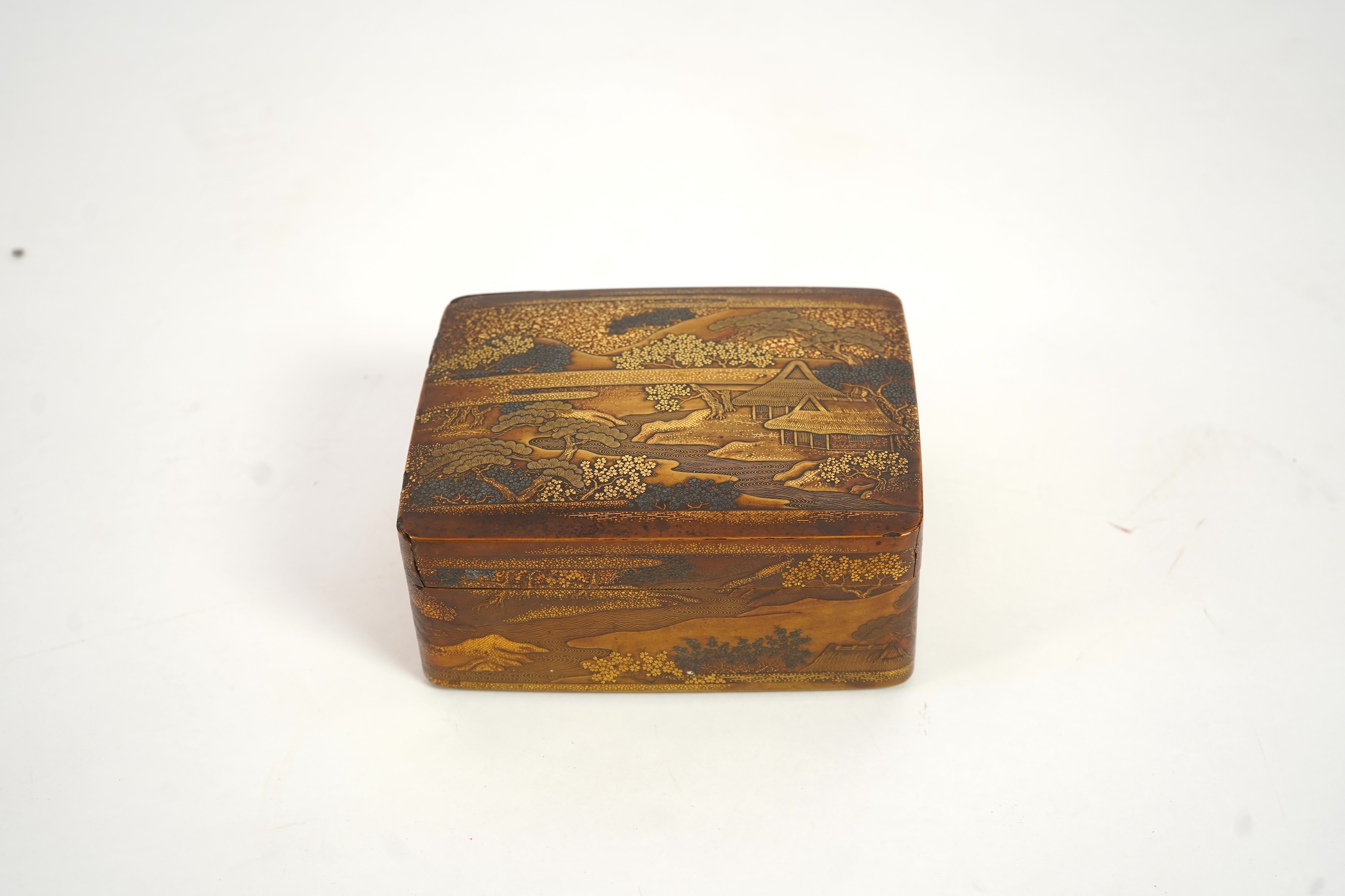 A Japanese gold lacquer ‘landscape’ box, tray and cover, 19th century